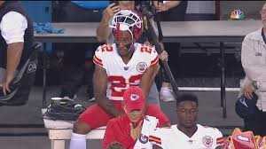 Marcus Peters kneels during national anthem